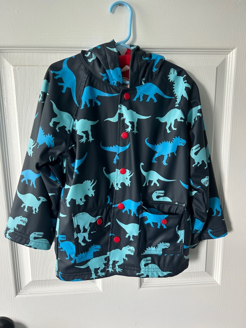 Hatley Navy Raincoat with Bright Blue Dinosaur Print and Red Lining